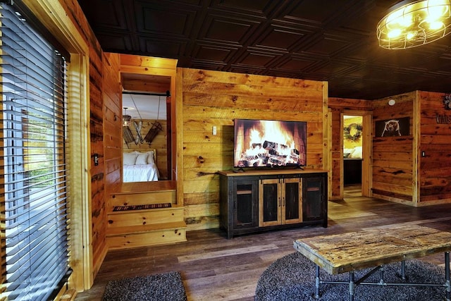 162 Grayson Pt, Blue Ridge, GA 30513 - living area featuring an ornate ceiling, wood walls, and dark wood-style flooring