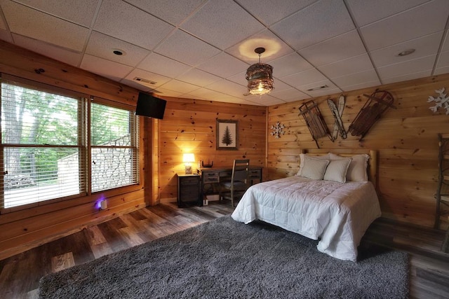 162 Grayson Pt, Blue Ridge, GA 30513 - bedroom featuring wood finished floors, a paneled ceiling, and wooden walls