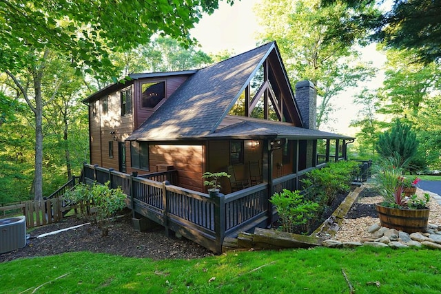 162 Grayson Pt, Blue Ridge, GA 30513 - rear view of property with a chimney, central air condition unit, a shingled roof, a wooden deck, and a lawn