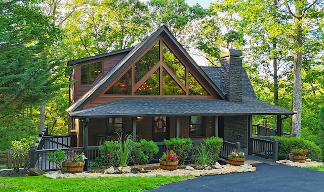 162 Grayson Pt, Blue Ridge, GA 30513 - view of front of house featuring a porch, a shingled roof, a chimney, and stone siding