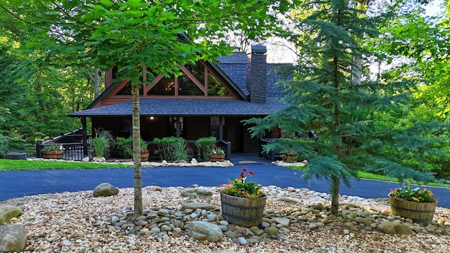 162 Grayson Pt, Blue Ridge, GA 30513 - view of front of home with a shingled roof, a porch, and a chimney