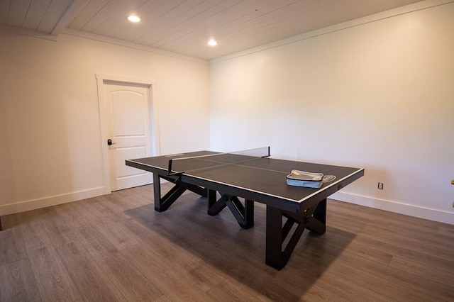 rec room featuring wood ceiling, dark hardwood / wood-style flooring, and crown molding