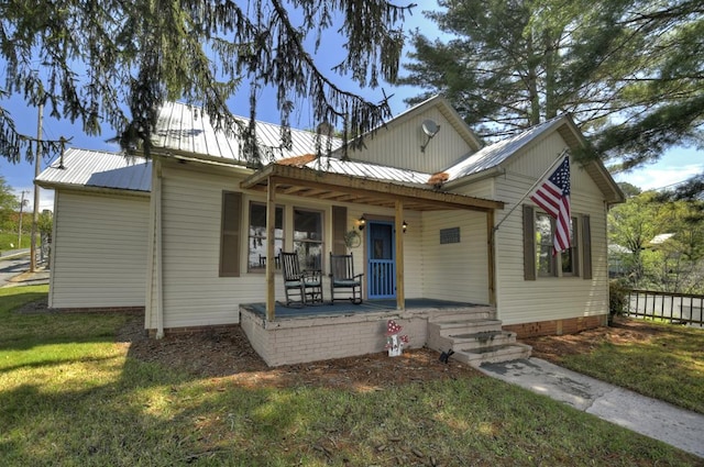 102 Riverview St, Copperhill, TN 37317 - bungalow with a porch, a front yard, and metal roof