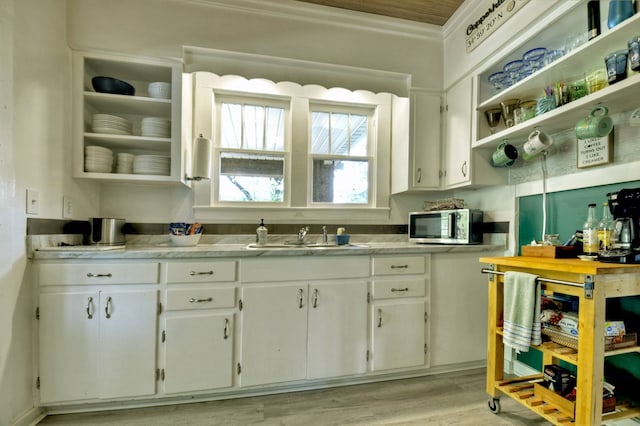 102 Riverview St, Copperhill, TN 37317 - kitchen with light countertops, white cabinetry, stainless steel microwave, and a sink