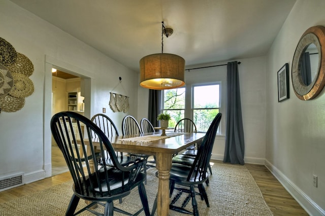 102 Riverview St, Copperhill, TN 37317 - dining area with baseboards, wood finished floors, and visible vents