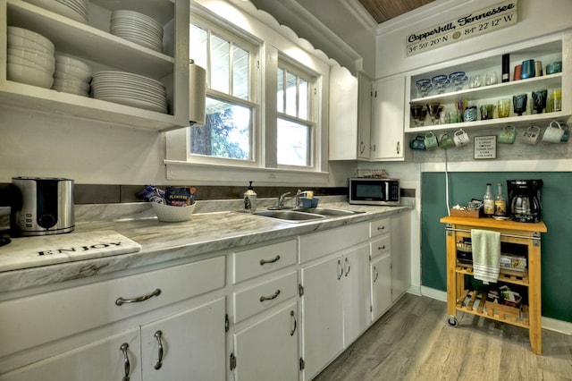 102 Riverview St, Copperhill, TN 37317 - kitchen featuring open shelves, a sink, stainless steel microwave, and white cabinetry