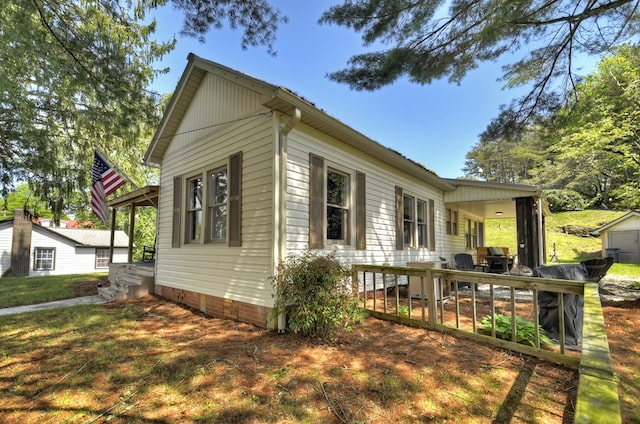 102 Riverview St, Copperhill, TN 37317 - view of home's exterior featuring a lawn
