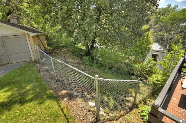 102 Riverview St, Copperhill, TN 37317 - view of yard with fence, an outbuilding, and a garage
