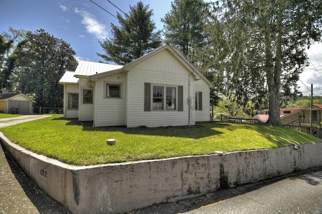 102 Riverview St, Copperhill, TN 37317 - view of side of home featuring a lawn, fence, and metal roof