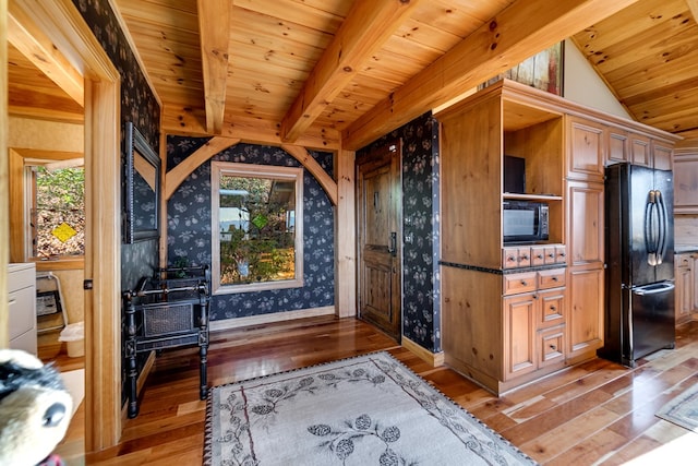 interior space featuring beamed ceiling, wood-type flooring, and wood ceiling