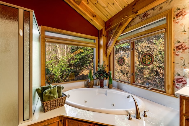 bathroom featuring vaulted ceiling, wooden ceiling, and a tub