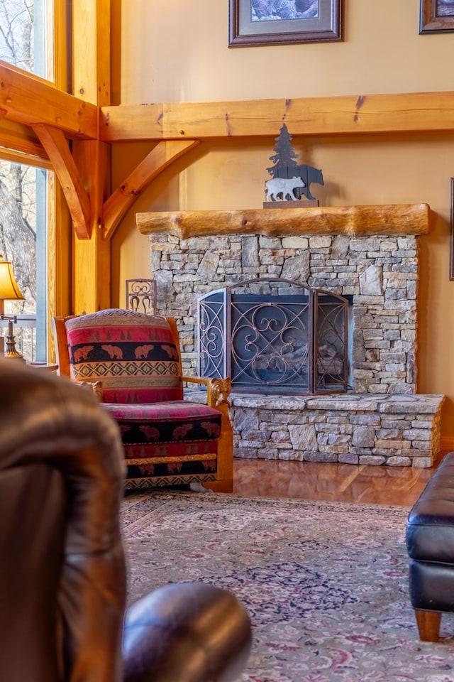 living room with a stone fireplace