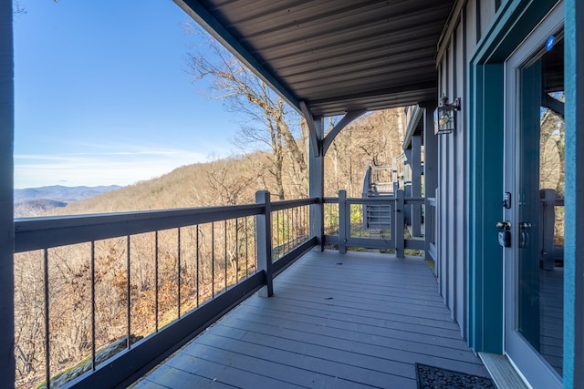 wooden deck featuring a mountain view