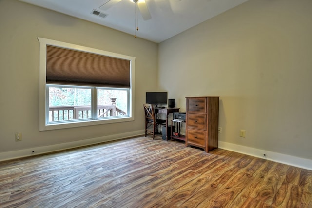 office with ceiling fan, wood finished floors, visible vents, and baseboards