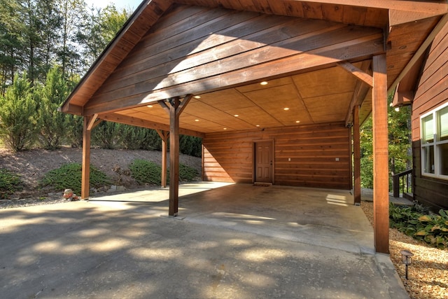 view of patio with a carport and driveway