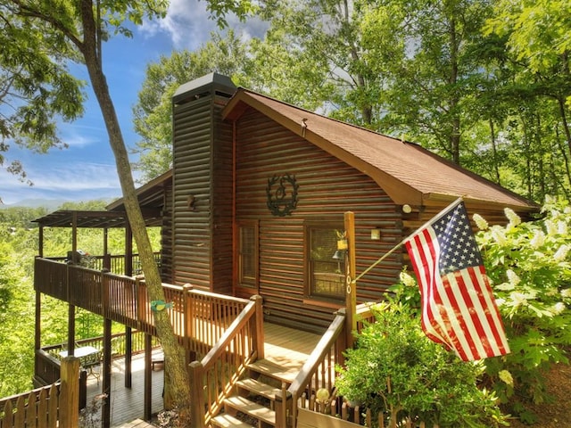 100 Smith Hill Rd, Cherry Log, GA 30522 - view of front of property with log exterior, a wooden deck, and a chimney