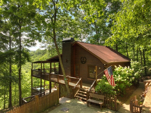 100 Smith Hill Rd, Cherry Log, GA 30522 - view of side of home featuring a deck, a chimney, log siding, and stairway