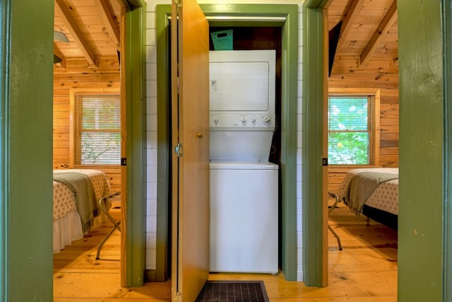 100 Smith Hill Rd, Cherry Log, GA 30522 - laundry area with wood walls, stacked washer / dryer, wood-type flooring, and wood ceiling