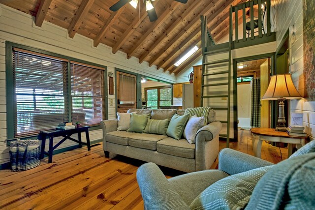 100 Smith Hill Rd, Cherry Log, GA 30522 - living area with wood-type flooring, a ceiling fan, high vaulted ceiling, wood walls, and wooden ceiling with exposed beams