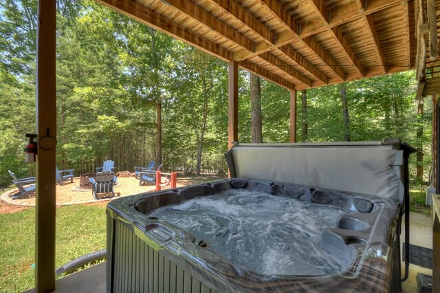 327 Dancing Trees Trl, Morganton, GA 30560 - view of patio with a hot tub and an outdoor fire pit