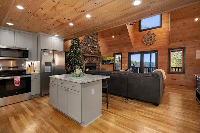 327 Dancing Trees Trl, Morganton, GA 30560 - kitchen featuring appliances with stainless steel finishes, wood ceiling, recessed lighting, high vaulted ceiling, and wood walls