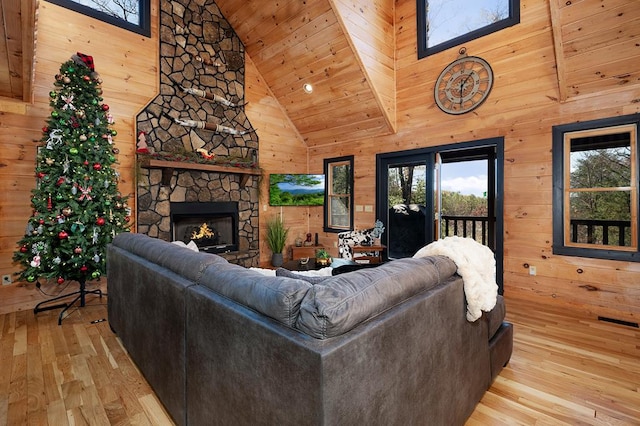 327 Dancing Trees Trl, Morganton, GA 30560 - living room with high vaulted ceiling, wood-type flooring, wooden walls, healthy amount of natural light, and wooden ceiling