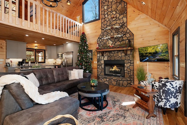 327 Dancing Trees Trl, Morganton, GA 30560 - living room featuring wooden ceiling, wood finished floors, high vaulted ceiling, a stone fireplace, and recessed lighting
