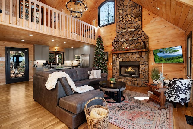 327 Dancing Trees Trl, Morganton, GA 30560 - living room featuring light wood-style flooring, high vaulted ceiling, a stone fireplace, wooden ceiling, and recessed lighting