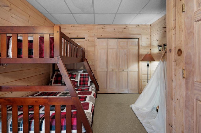 327 Dancing Trees Trl, Morganton, GA 30560 - bedroom featuring wooden walls, carpet floors, and a drop ceiling