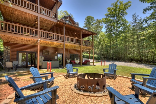 327 Dancing Trees Trl, Morganton, GA 30560 - view of patio featuring a fire pit and french doors