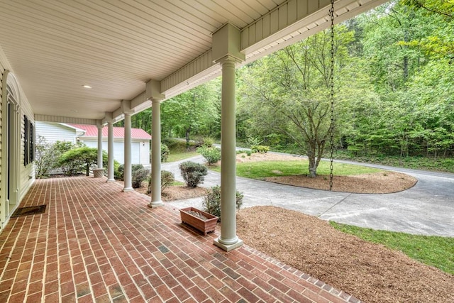 view of patio featuring a porch