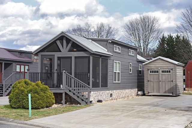 view of front of home featuring stairs, a shed, crawl space, and an outdoor structure