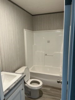755 Orchard, Ellijay, GA 30540 - bathroom featuring vanity, wood finished floors, washtub / shower combination, and wooden walls