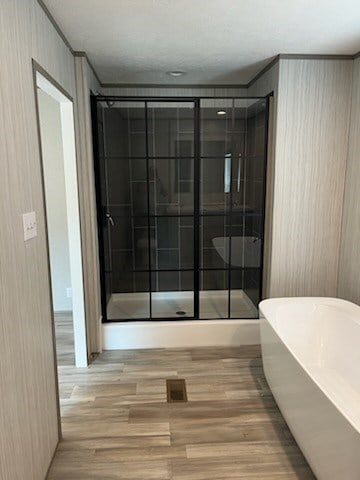755 Orchard, Ellijay, GA 30540 - full bath featuring wood finished floors, a freestanding bath, and a shower stall