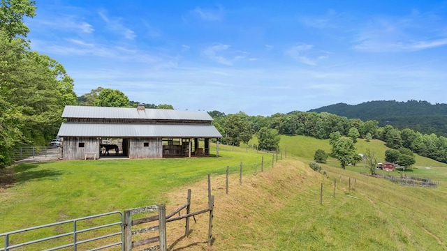 102 Cross Creek Ln, Warne, NC 28909 - rear view of property featuring an exterior structure, an outbuilding, a metal roof, and a view of rural / pastoral area
