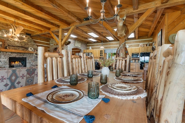 102 Cross Creek Ln, Warne, NC 28909 - dining space featuring a chandelier, a stone fireplace, and a wooden ceiling with exposed beams
