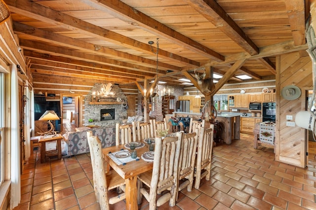 102 Cross Creek Ln, Warne, NC 28909 - dining area with a stone fireplace, a wooden ceiling with exposed beams, and a chandelier