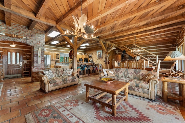 102 Cross Creek Ln, Warne, NC 28909 - living area featuring a chandelier, a wood ceiling with exposed beams, stairway, and wooden walls