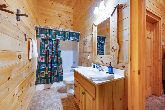 full bathroom featuring shower / tub combo with curtain, wood walls, toilet, and tile patterned flooring