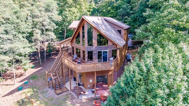 192 Oak Ridge Way, Morganton, GA 30560 - rear view of house featuring a deck, stairs, faux log siding, cooling unit, and a patio area