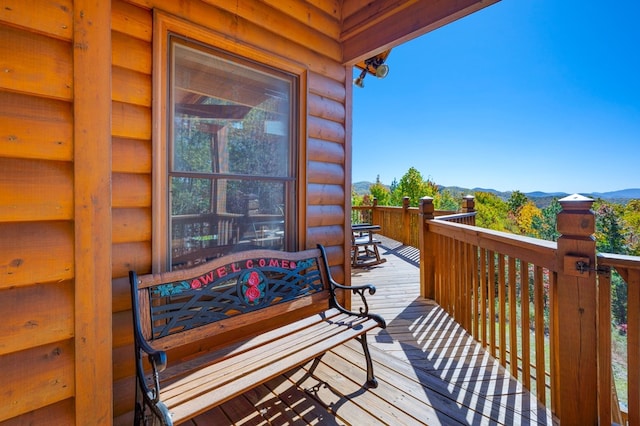 wooden terrace with a mountain view