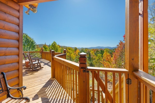 wooden terrace featuring a mountain view