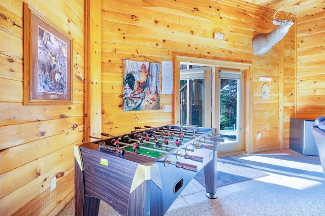 playroom featuring wood walls