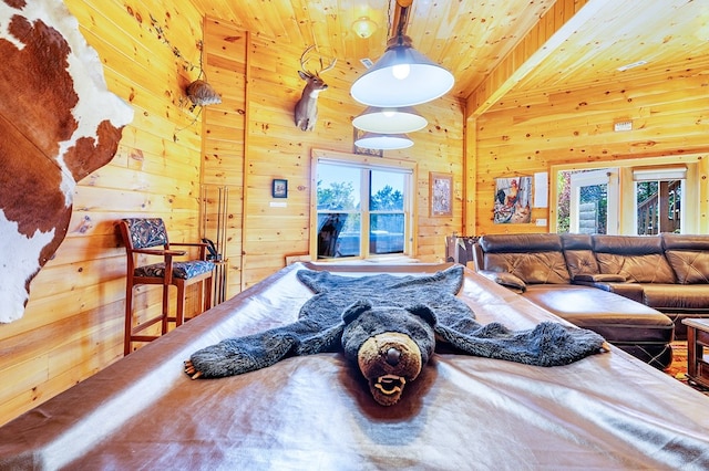 living room featuring wood walls, beam ceiling, and wood ceiling