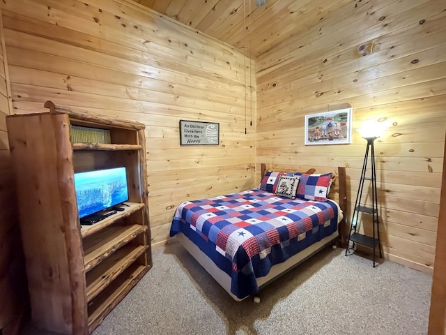 bedroom with wood walls, wooden ceiling, and carpet flooring