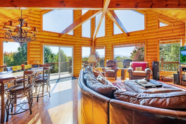 192 Oak Ridge Way, Morganton, GA 30560 - living area with a chandelier, high vaulted ceiling, a skylight, wood finished floors, and beam ceiling