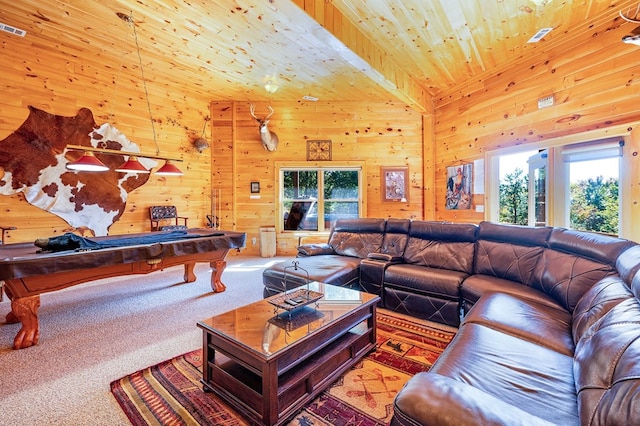 living room featuring plenty of natural light, wooden walls, and wood ceiling