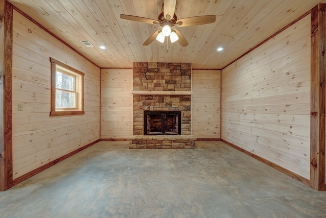 unfurnished living room featuring wooden walls, concrete flooring, ceiling fan, wood ceiling, and a fireplace