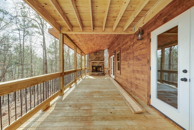 wooden deck with a fireplace