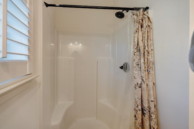 bathroom with curtained shower